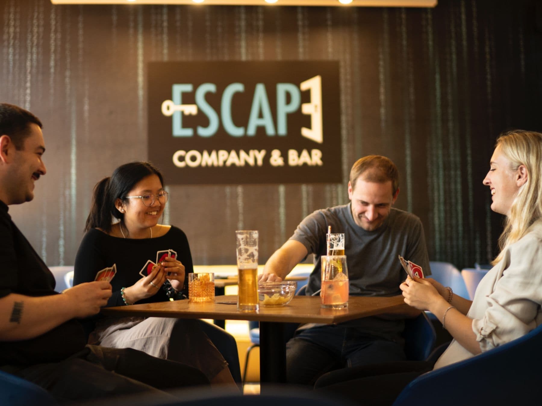 Escape Game: Friends enjoy an exciting game night at a bar. Ideal for group activities.