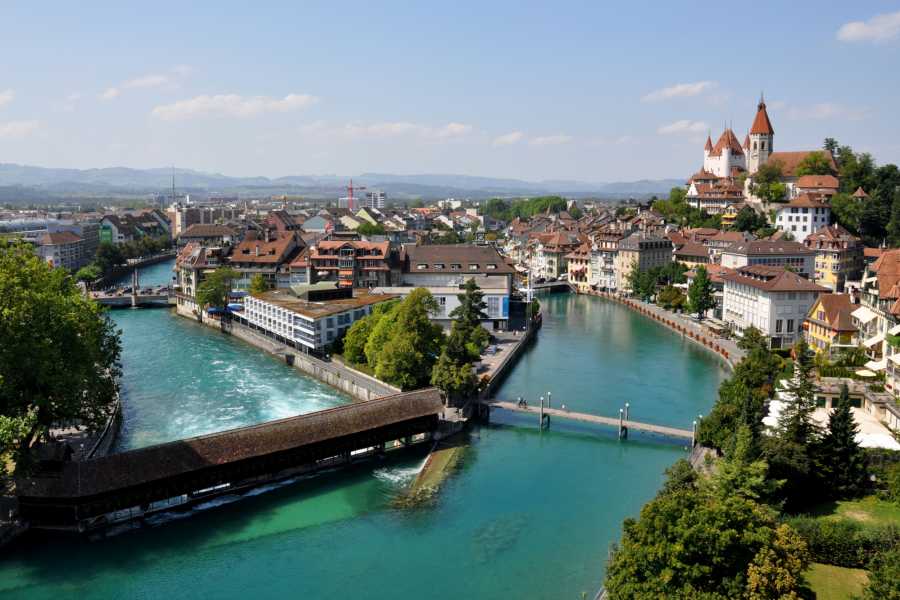 Bridges in Thun with a view of the Old Town, river, and mountains