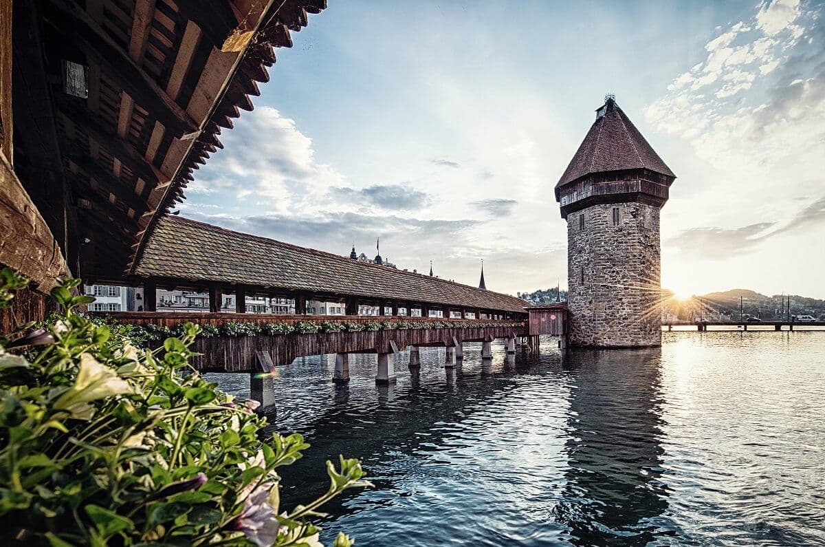Lucerne Day Trip shows the Chapel Bridge and Water Tower at sunset