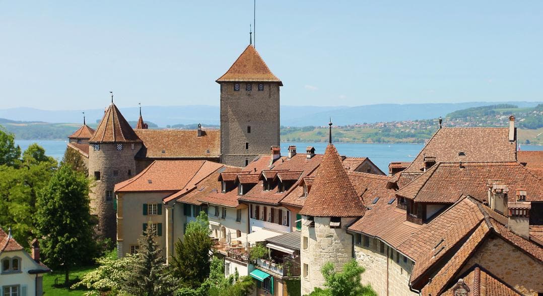 Murten Castle Tower with historical architecture and surroundings by the lake