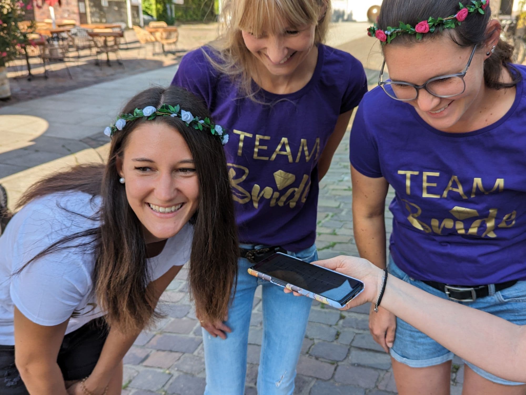 Beat the Bride: Team activity with joyful women at an outdoor event.