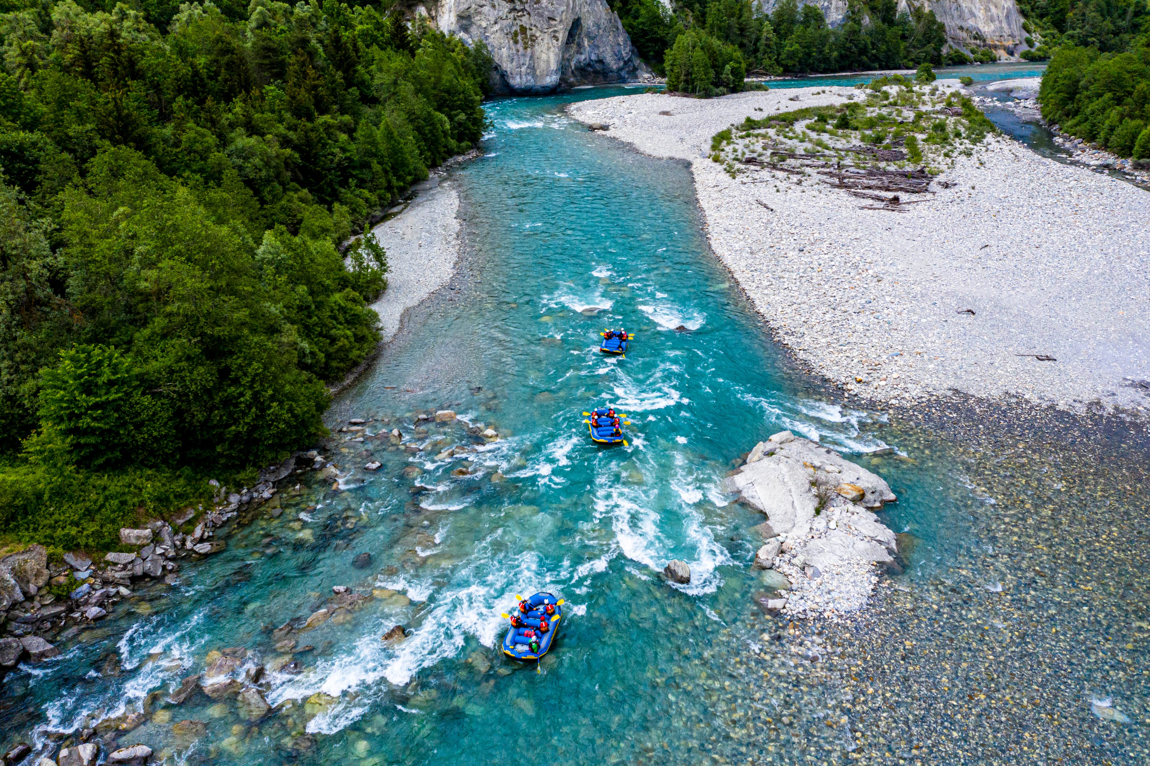 Rafting Vorderrhein in 2023, boats on the clear water, surrounding forests