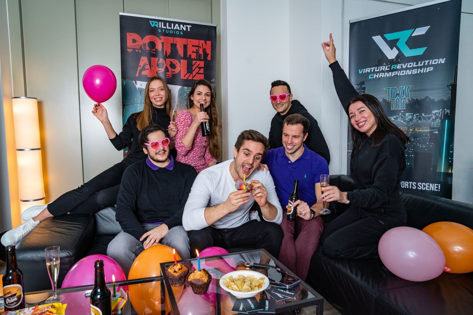 VRilliant: Celebrate with friends at a VR party with drinks and decorations in a modern room.