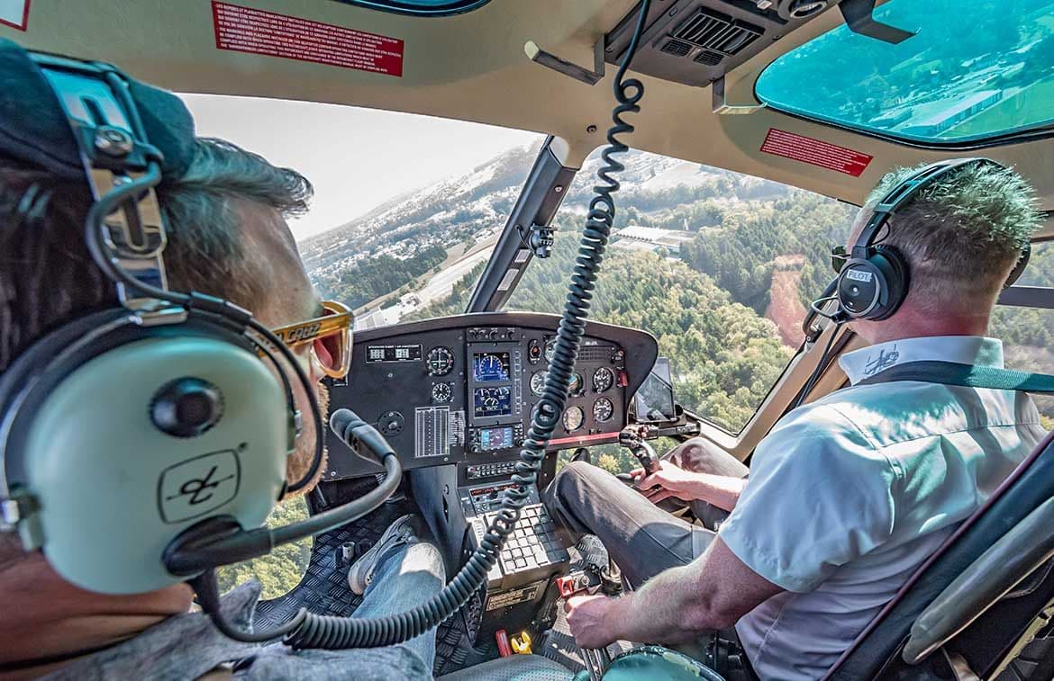 Helicopter sightseeing flight Lucerne with pilot and view into the cockpit.