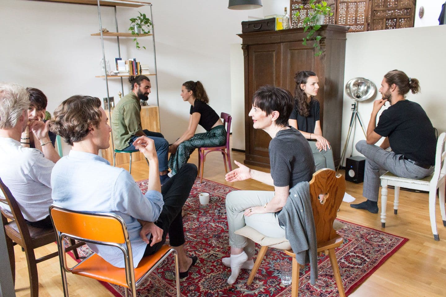 talking in a lively group discussion with friends and family, creative conversations and collective learning