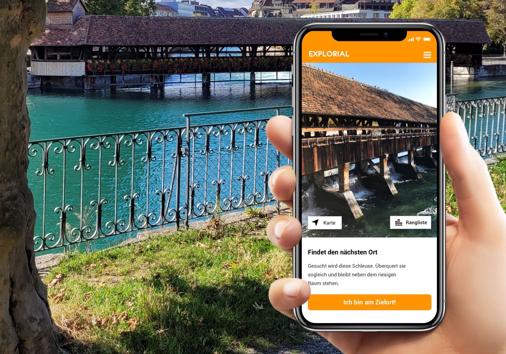 Scavenger hunt: Smartphone shows map at a picturesque bridge over the river.