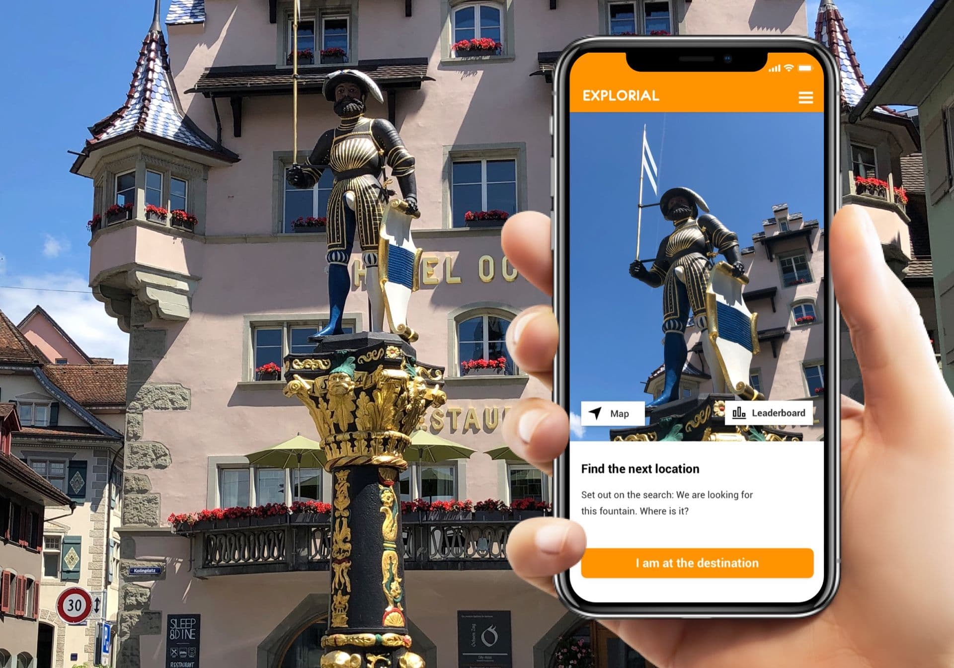 Treasure Hunt: Smartphone shows knight statue in front of historic buildings in the city.